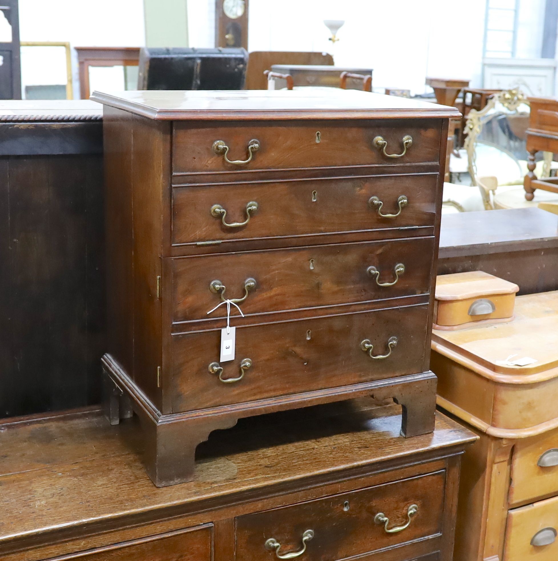 A small George III mahogany chest converted to a drinks cabinet, width 70cm, depth 45cm, height 77cm